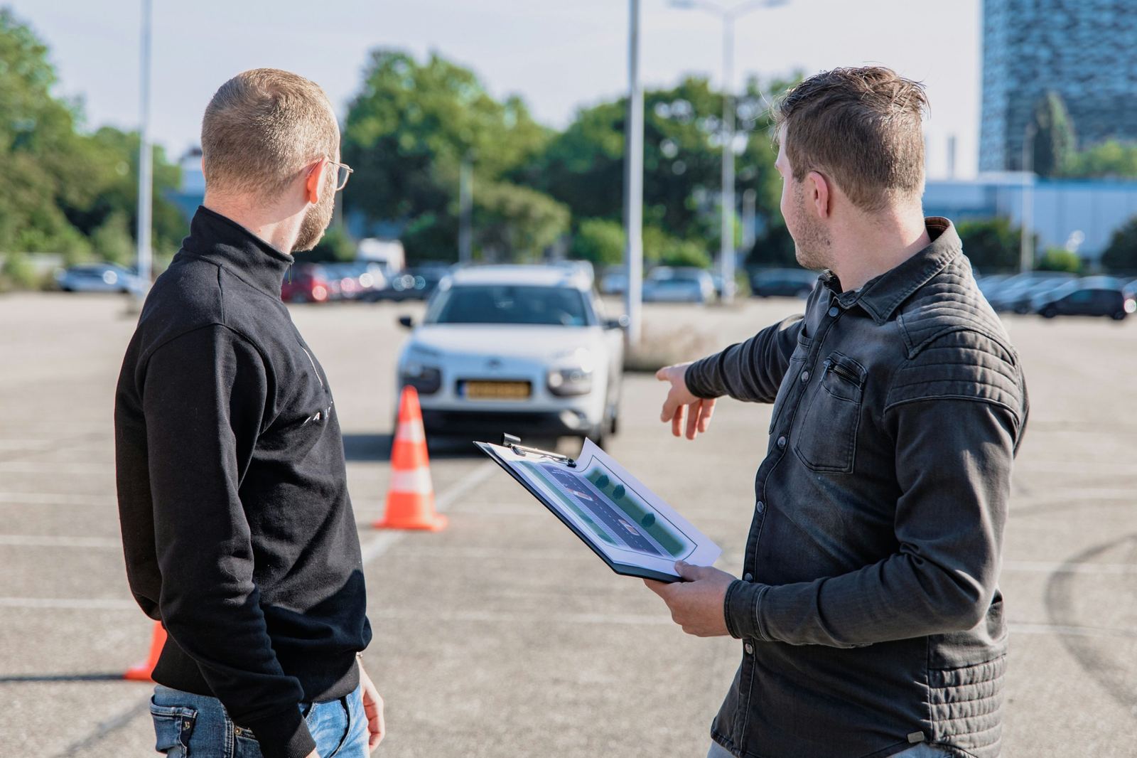 Driving instructor going over a lesson plan with a student